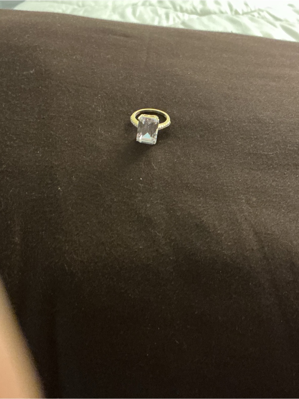 Elegant Gold-Tone Ring with Clear Emerald-Cut Stone